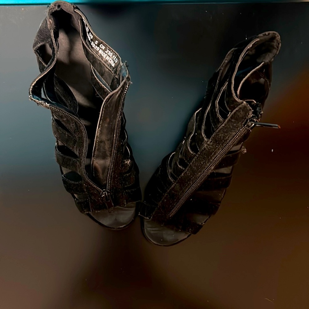 pair of zip up black wedges